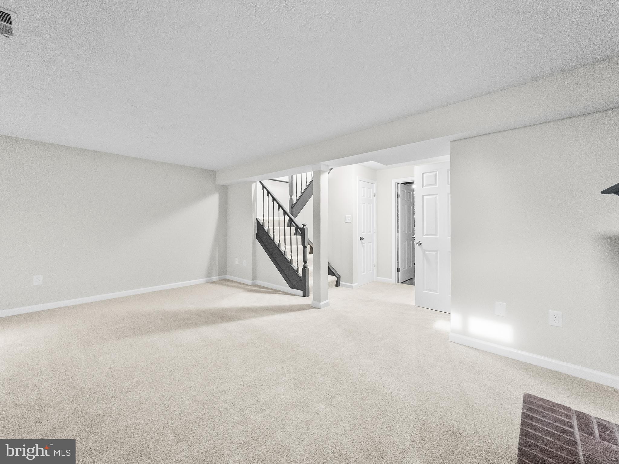 10110 Shelldrake Circle Damascus, MD 20872 - Photo 29 of 35 a view of an empty room with stairs