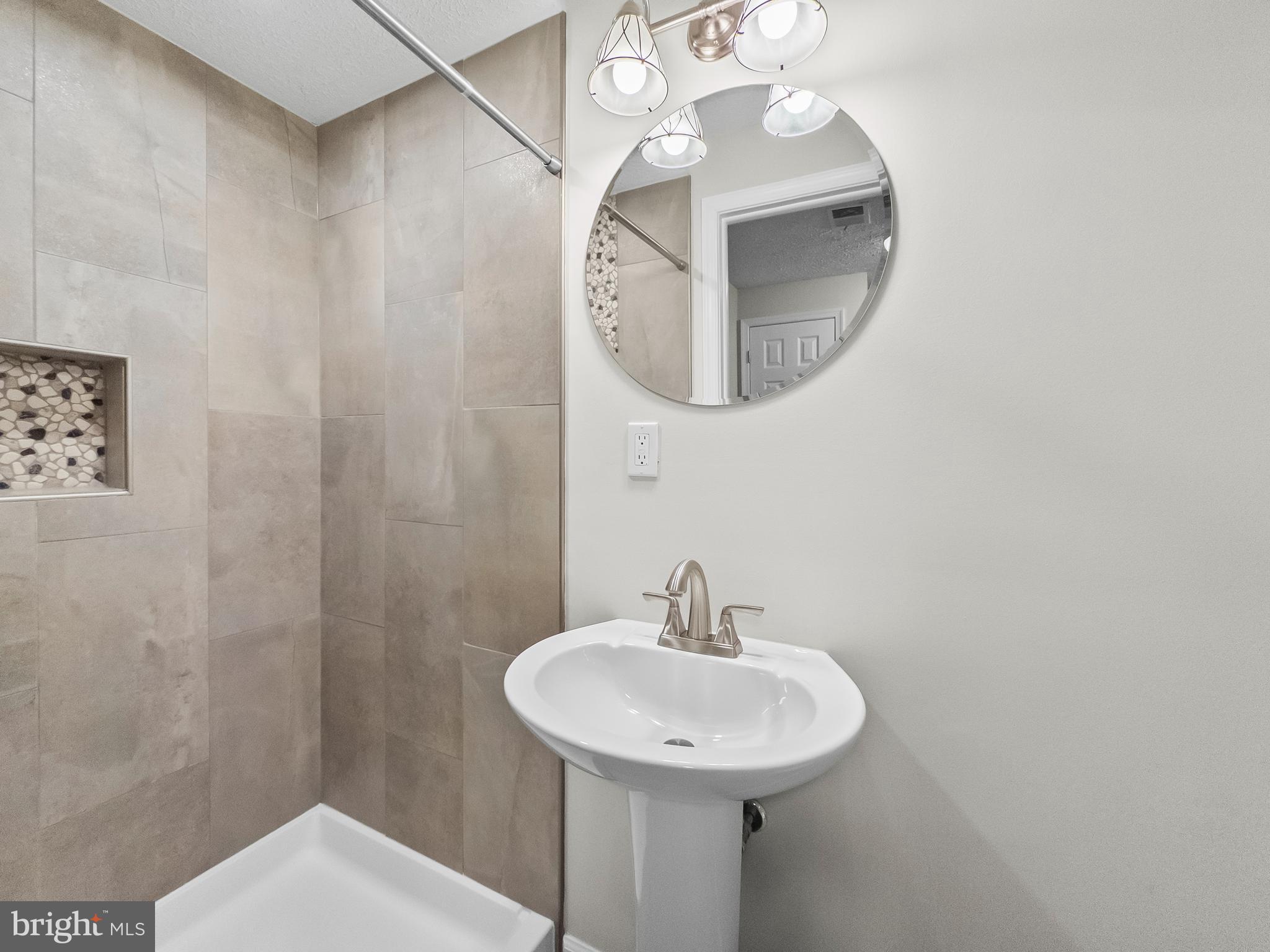 10110 Shelldrake Circle Damascus, MD 20872 - Photo 30 of 35 a bathroom with a sink and a mirror