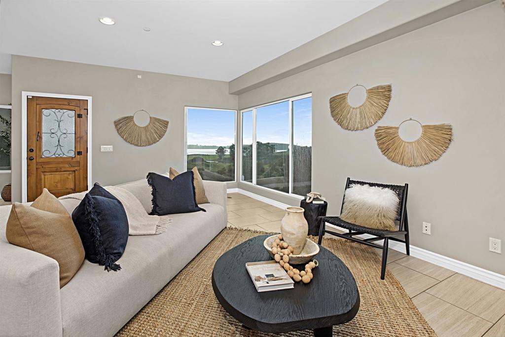 363 Maria Avenue Spring Valley, CA 91977 - Photo 4 of 19 a living room with furniture and a large window