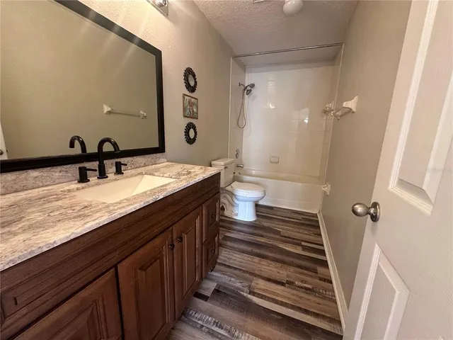 a view of a livingroom with wooden floor