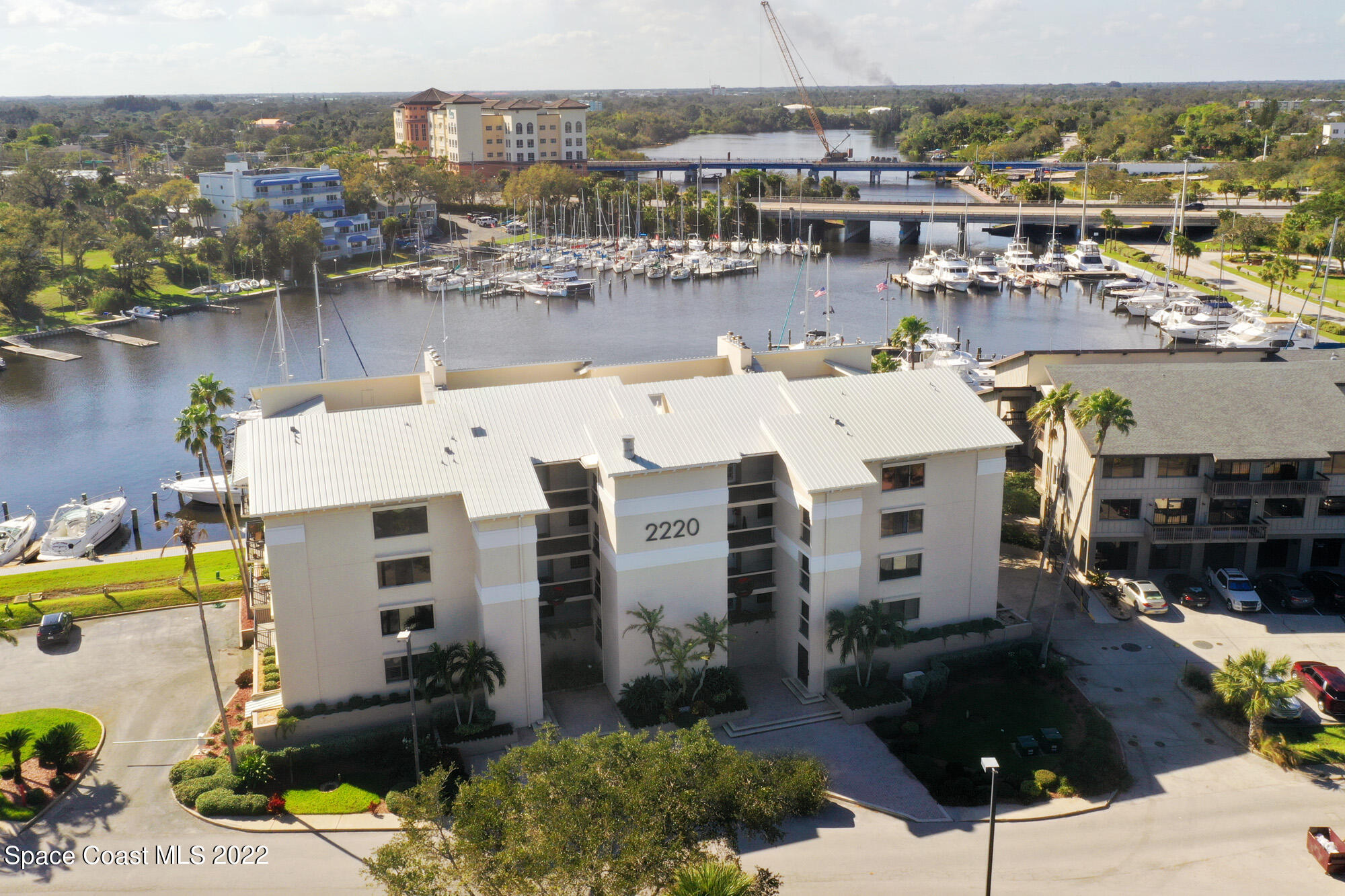 a aerial view of a house with outdoor space and lake view