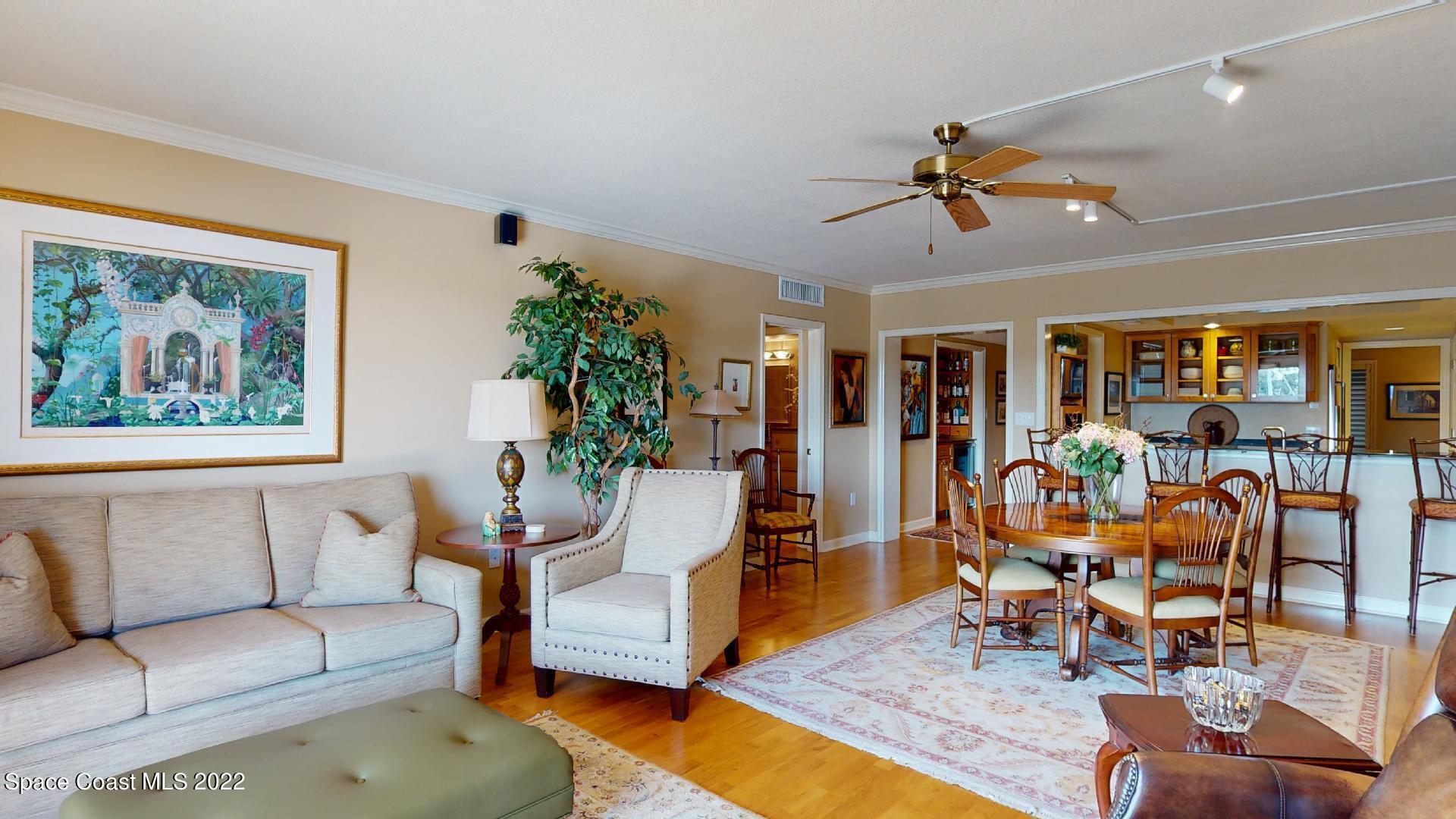2220 Front Street, Unit 303 Melbourne, FL 32901 - Photo 14 of 29 a living room with furniture and wooden floor