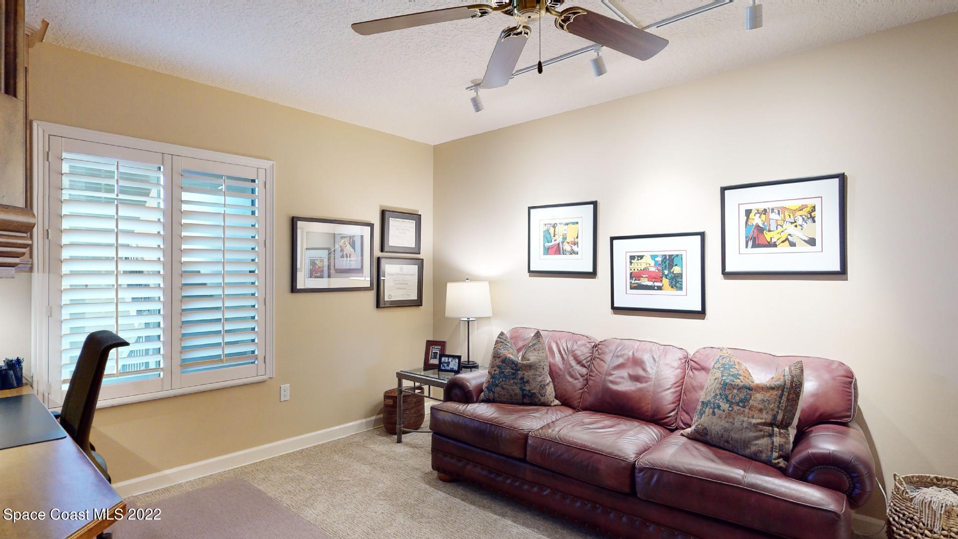 2220 Front Street, Unit 303 Melbourne, FL 32901 - Photo 24 of 29 a living room with furniture and a window