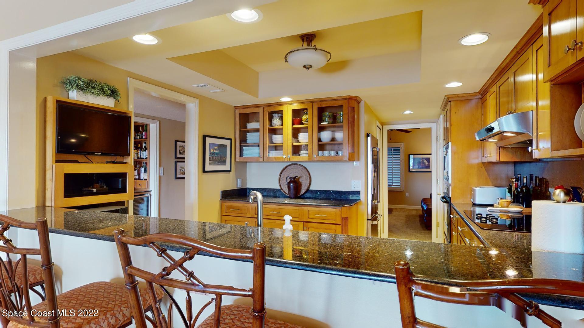 2220 Front Street, Unit 303 Melbourne, FL 32901 - Photo 9 of 29 a room with lots of chairs and mirrors