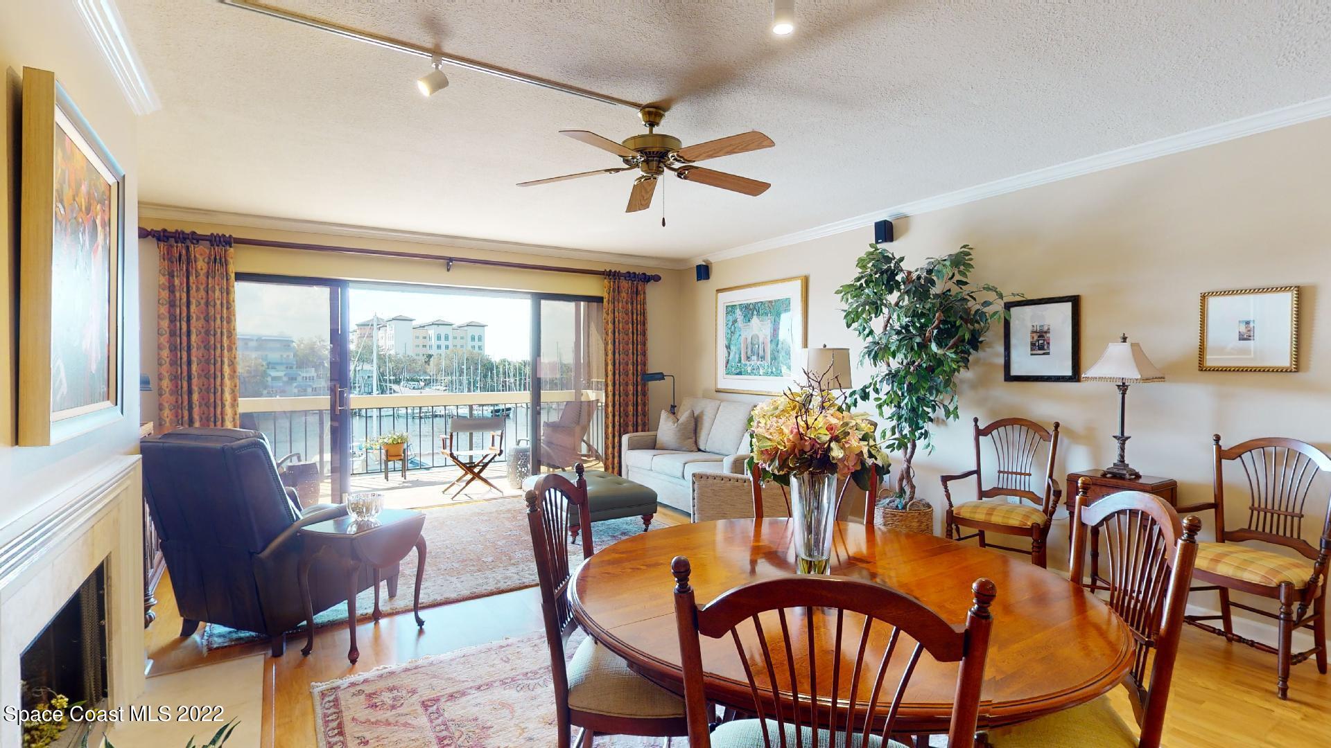 2220 Front Street, Unit 303 Melbourne, FL 32901 - Photo 10 of 29 a dining room with furniture a chandelier and window