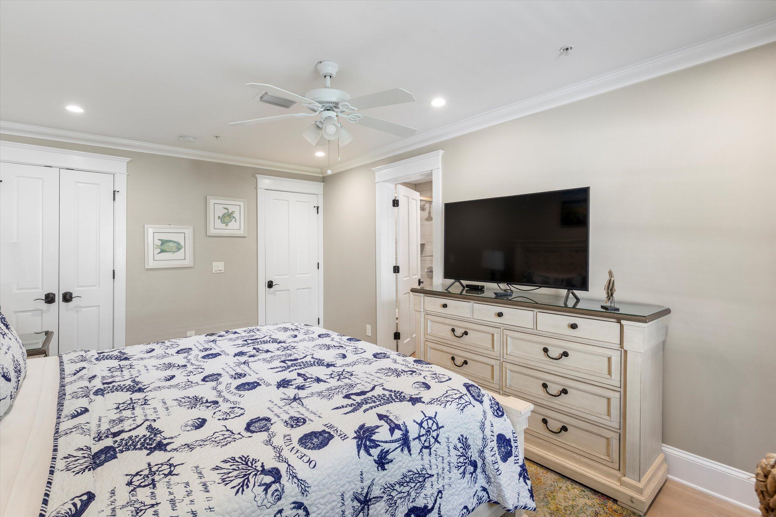 421-423 Simonton Street Key West, FL 33040 - Photo 14 of 37 a bedroom with a bed and a flat screen tv
