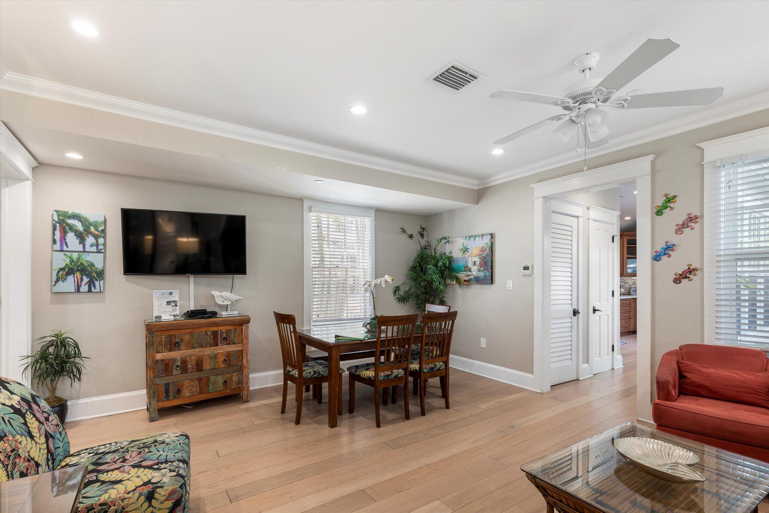 421-423 Simonton Street Key West, FL 33040 - Photo 17 of 37 a living room with furniture and a flat screen tv