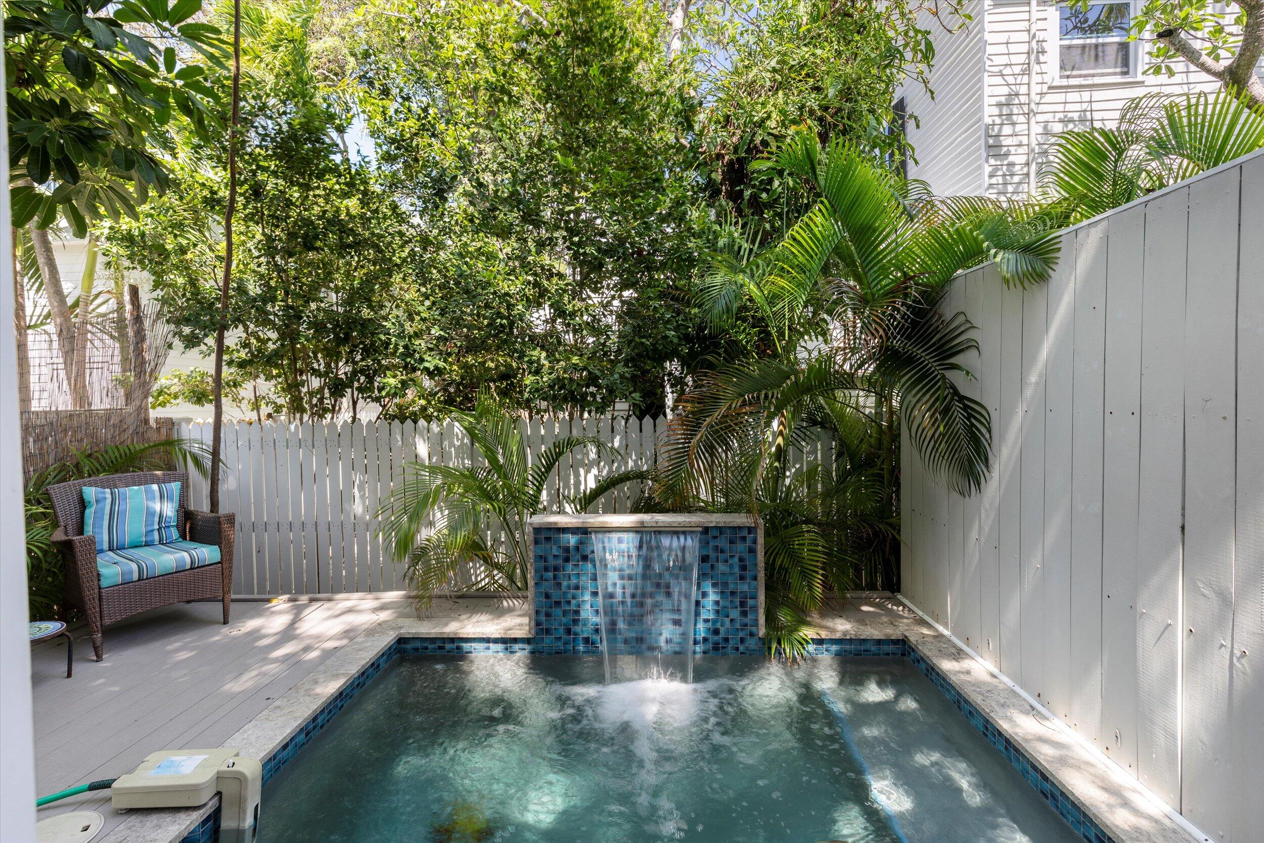 421-423 Simonton Street Key West, FL 33040 - Photo 24 of 37 a view of backyard with outdoor and trees