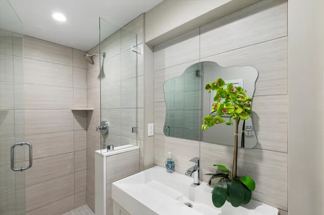 a bathroom with a sink and shower