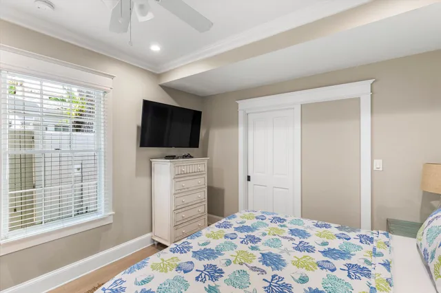 a bedroom with a bed and flat screen tv