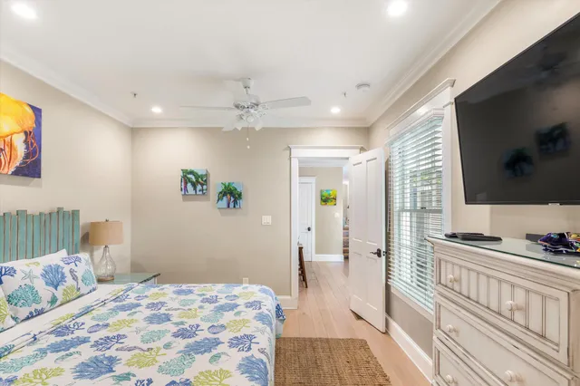 a bedroom with a bed and a flat screen tv