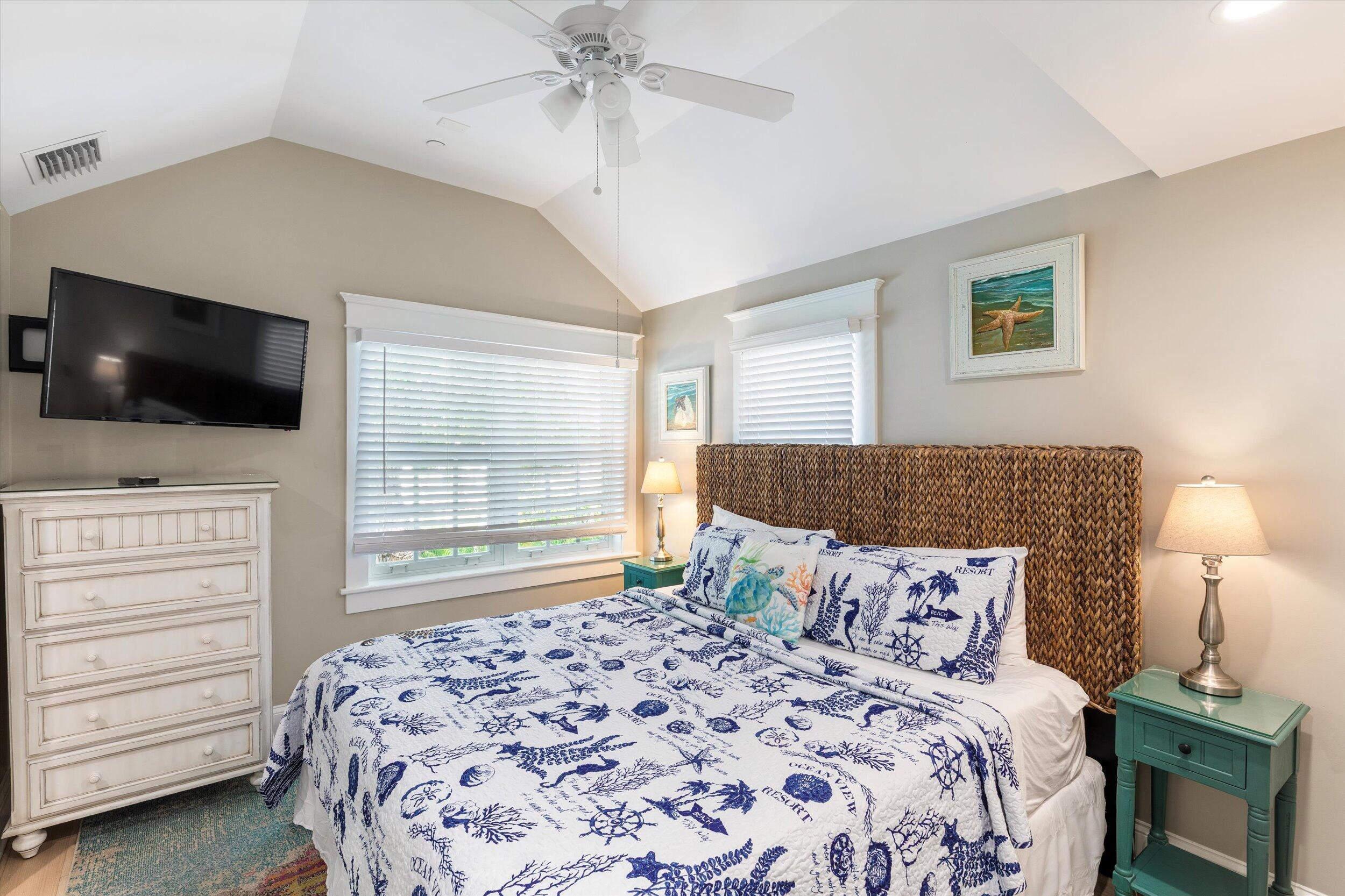 421-423 Simonton Street Key West, FL 33040 - Photo 32 of 37 a bedroom with a bed and a flat tv screen on dresser
