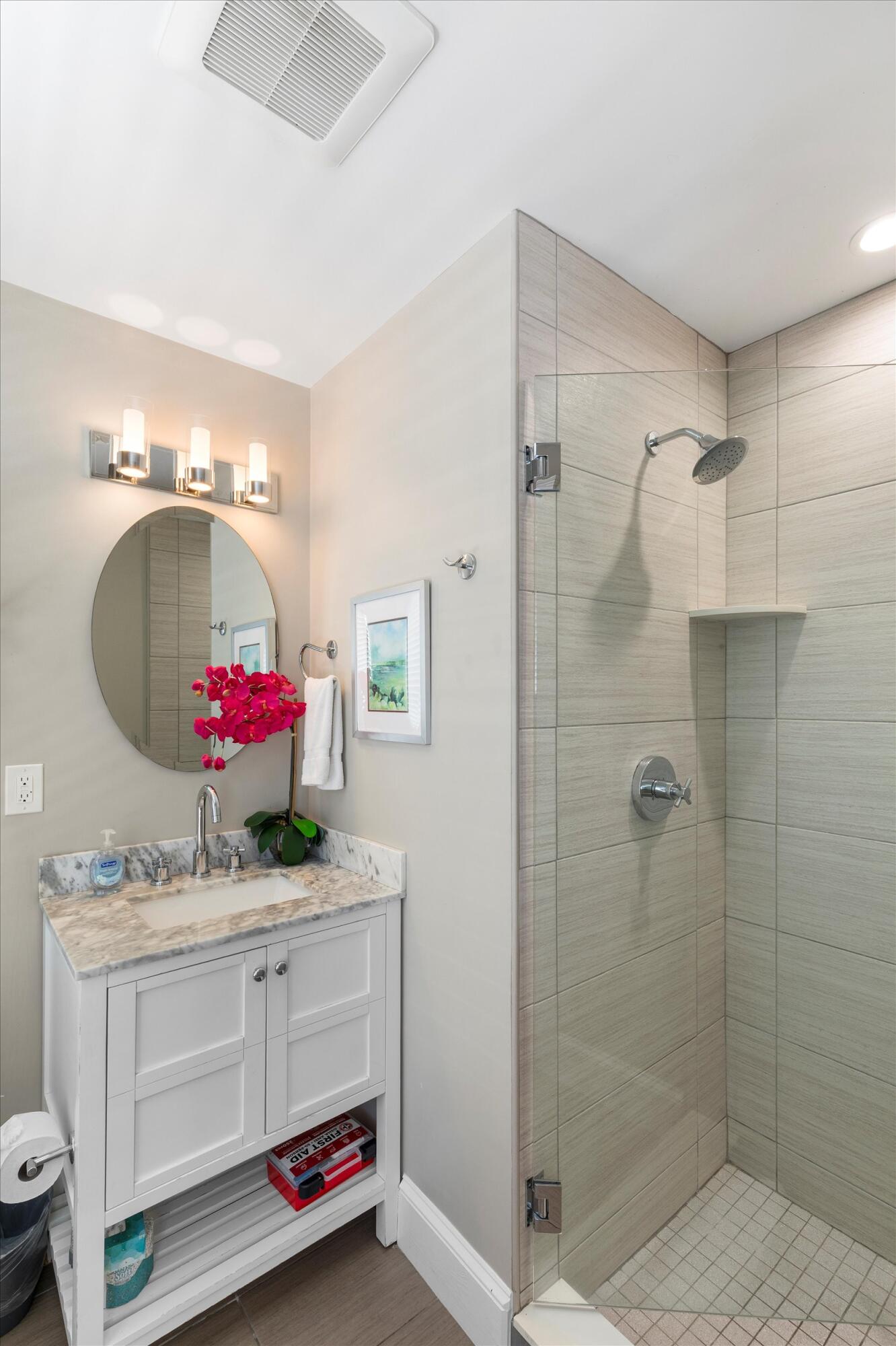 421-423 Simonton Street Key West, FL 33040 - Photo 37 of 37 a bathroom with a sink vanity and a mirror