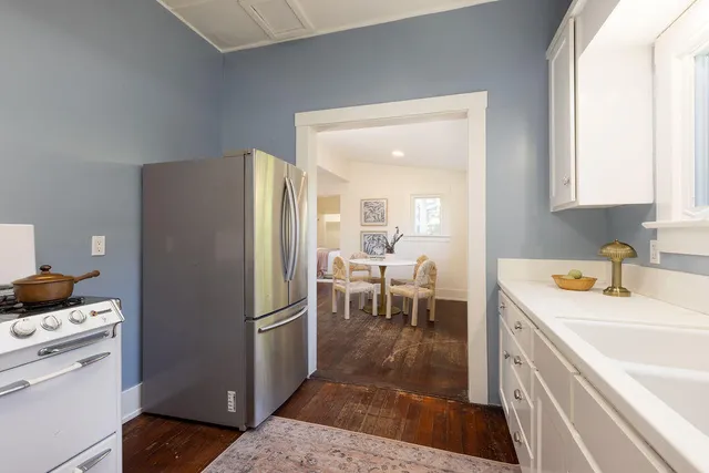 a kitchen with a refrigerator and a sink
