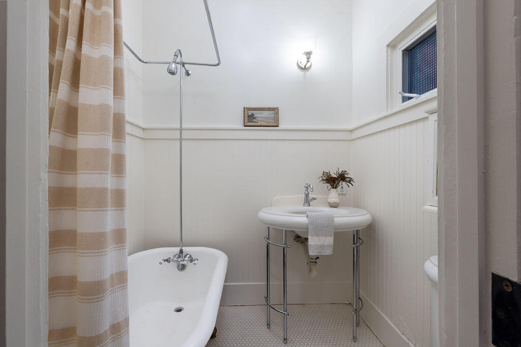 712 Castillo Street Santa Barbara, CA 93101 - Photo 17 of 28 a bathroom with a sink a toilet and shower
