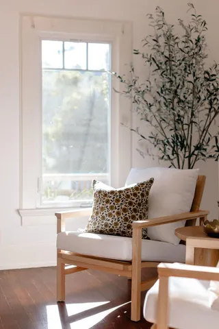 a table with a glass top table and chairs