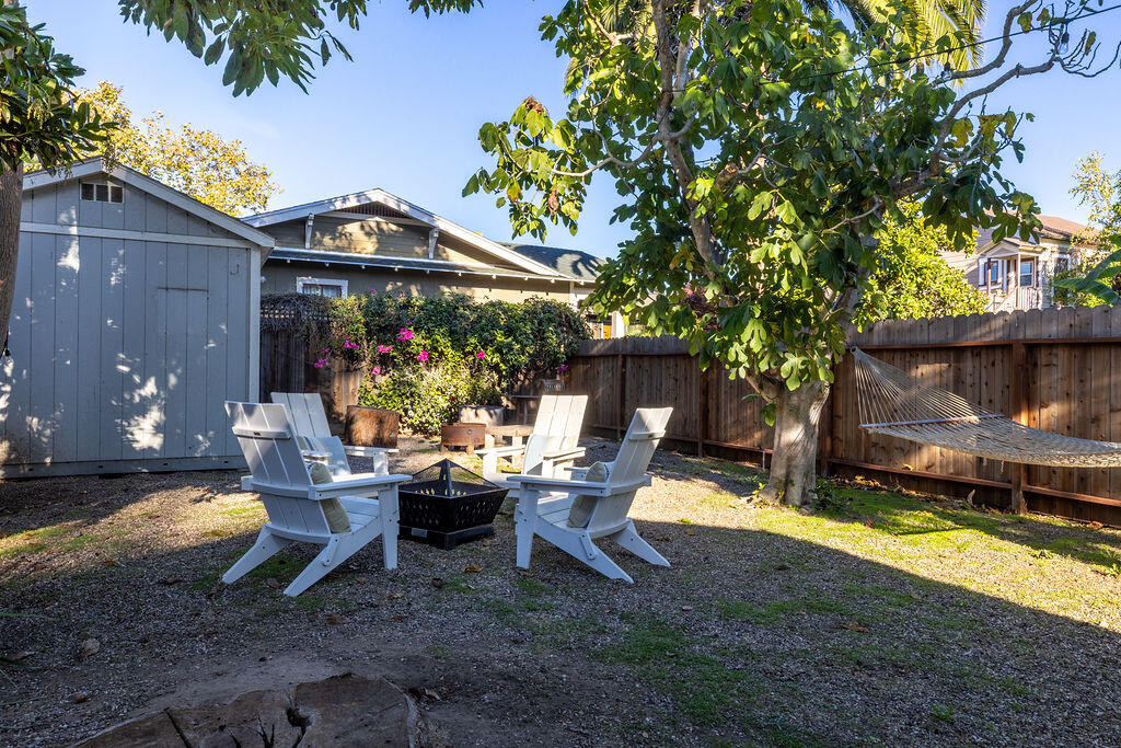 712 Castillo Street Santa Barbara, CA 93101 - Photo 24 of 28 a backyard of a house with yard and outdoor seating