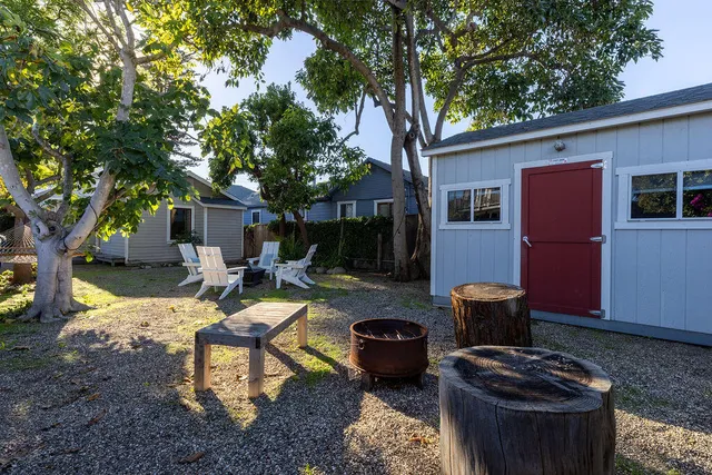 a backyard of a house with seating space