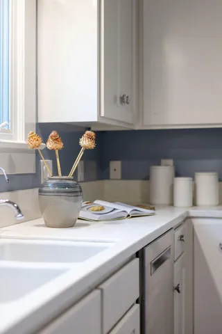 a kitchen with a sink and cabinets