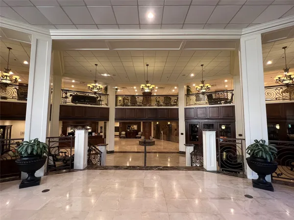 a room with lots of potted plants