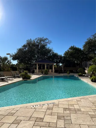 a view of a garden with a house in the background