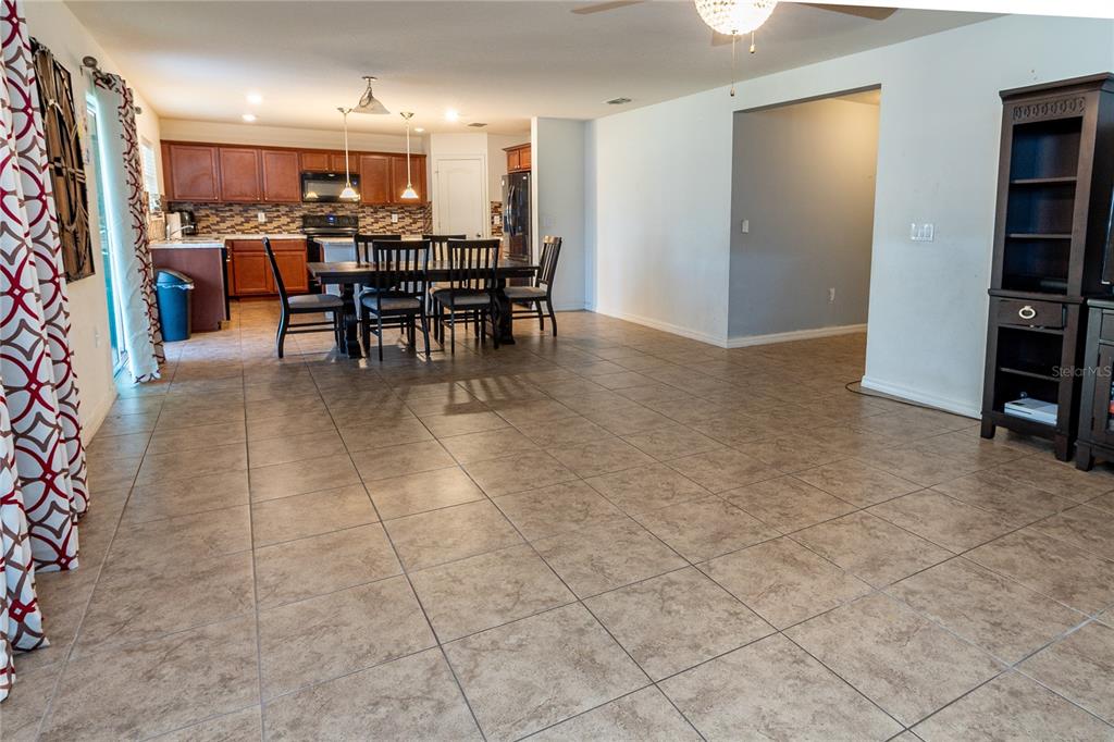 4563 Orchard Grove Road St. Cloud, FL 34772 - Photo 35 of 51 a view of a dining room with furniture