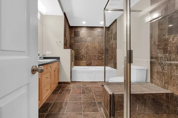 a bathroom with a bathtub and a shower