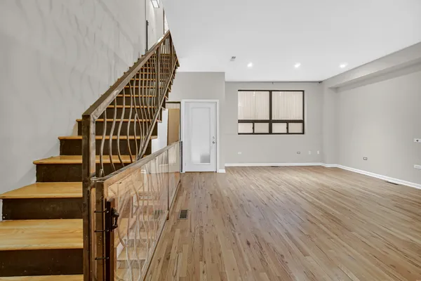 an entryway in a hall with wooden floor