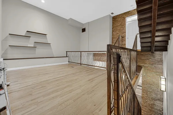 a view of entryway with wooden floor