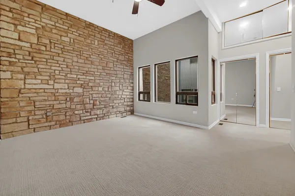 a view of an empty room with windows