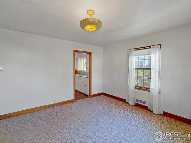 a view of an empty room and window