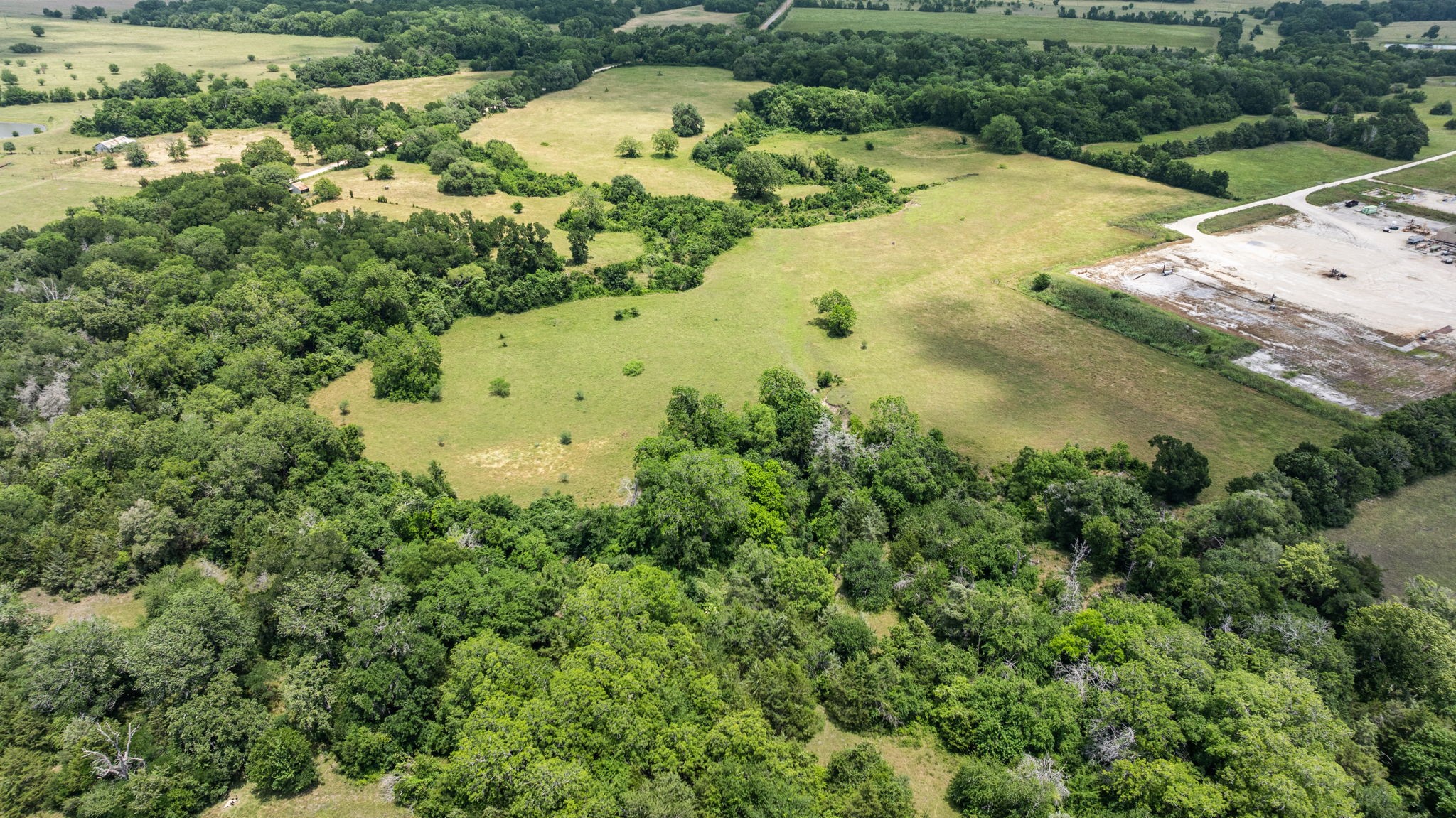 1268 Stokes Road Fayetteville, TX 78940 - Photo 11 of 21 an aerial view of a residential houses with outdoor space and trees all around