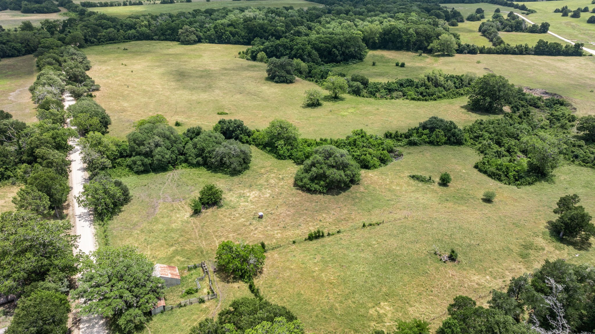 1268 Stokes Road Fayetteville, TX 78940 - Photo 12 of 21 an aerial view of residential houses with yard and lake view