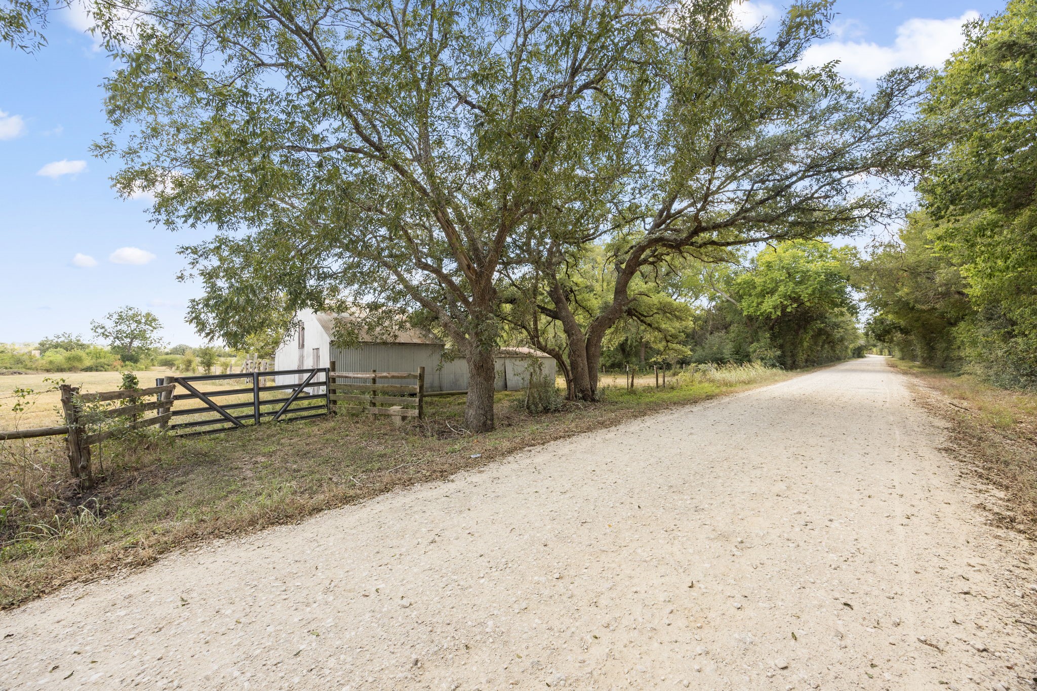 1268 Stokes Road Fayetteville, TX 78940 - Photo 20 of 21 a view of a yard with wooden fence