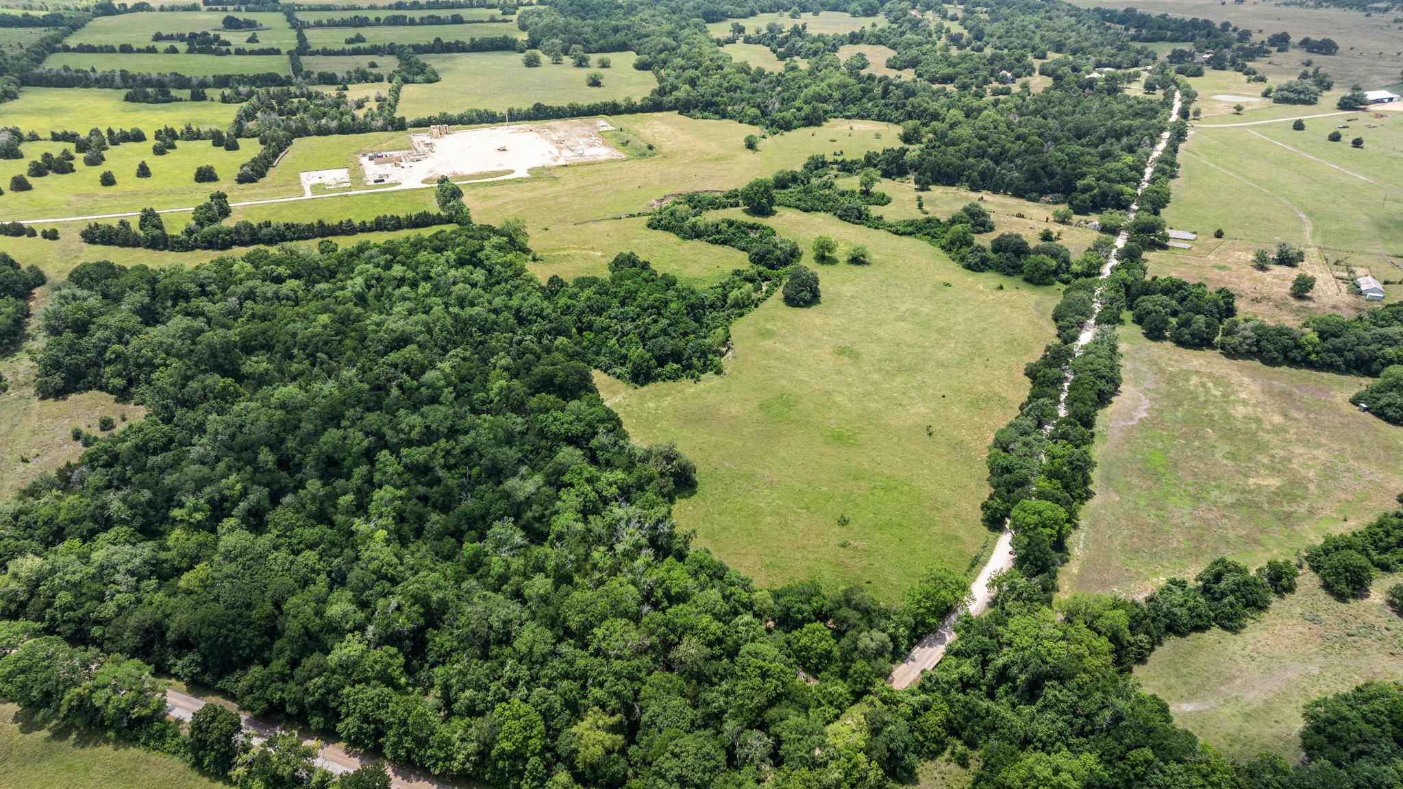 1268 Stokes Road Fayetteville, TX 78940 - Photo 3 of 21 an aerial view of residential houses with outdoor space and trees all around