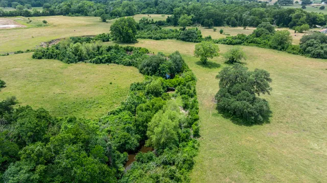 a view of a lake with a yard