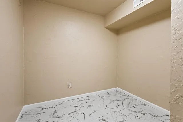 a view of small space with wooden floor