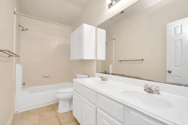 a bathroom with a sink a toilet and a bathtub