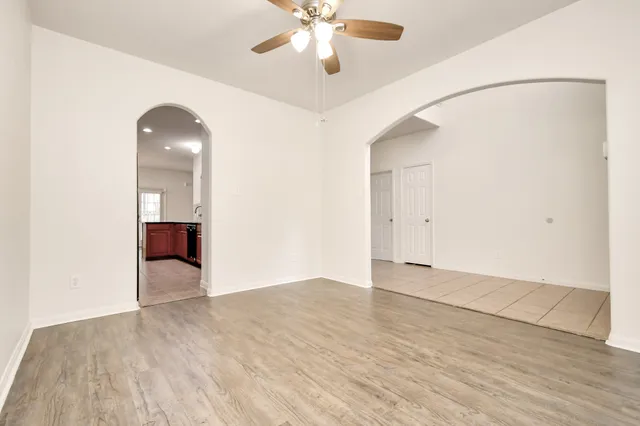 wooden floor in an empty room with a window