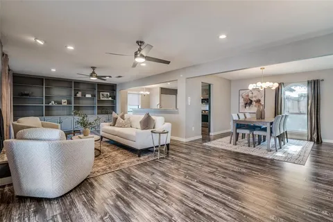 a living room with furniture and a table