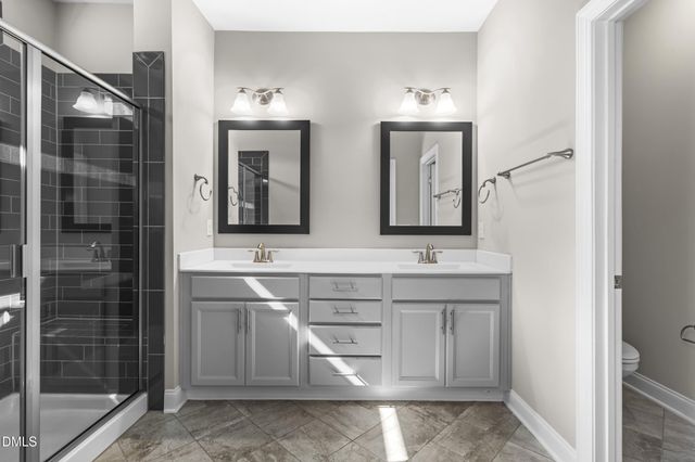 a dining hall with stainless steel appliances granite countertop a stove oven a dining table and chairs with wooden floor