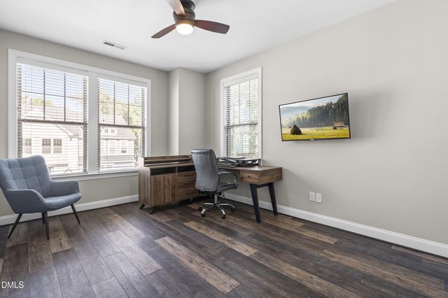 a view of walk in closet with clothes