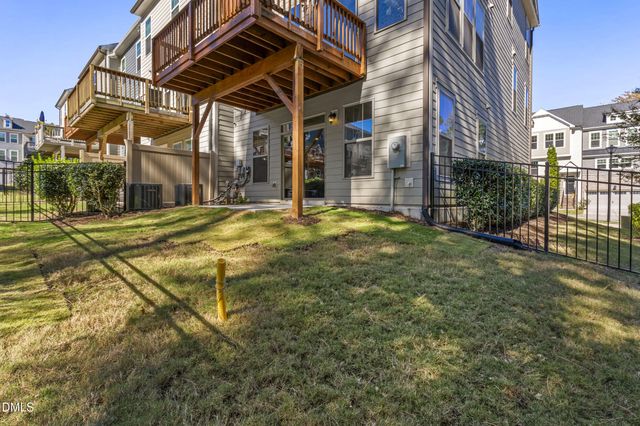 a view of balcony with wooden floor and fence