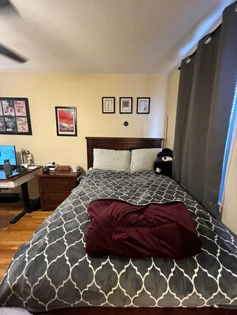 a bedroom with a bed and a dresser