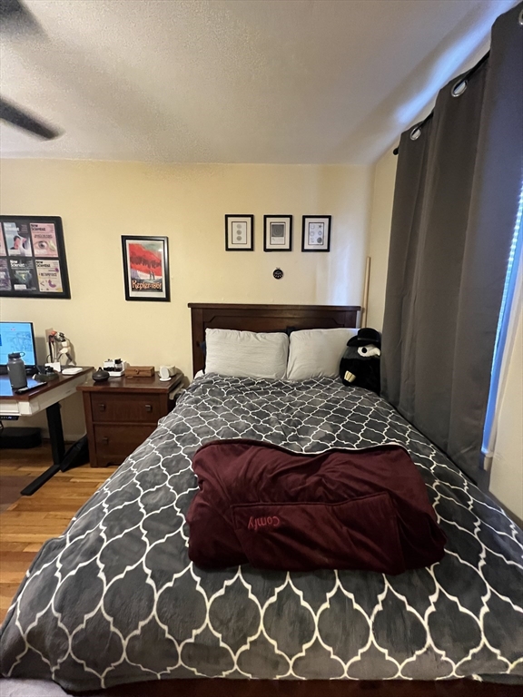 41 Cross Street Somerville, MA 02145 - Photo 11 of 42 a bedroom with a bed and a dresser