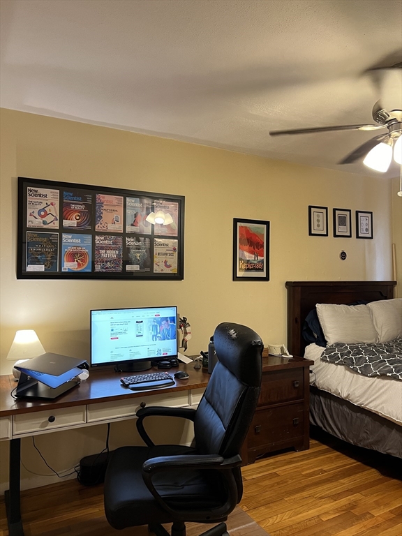 41 Cross Street Somerville, MA 02145 - Photo 17 of 42 a living room with furniture and window