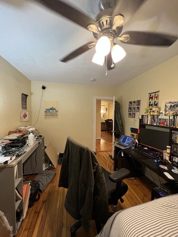 41 Cross Street Somerville, MA 02145 - Photo 20 of 42 a bedroom with a bed and wooden floor