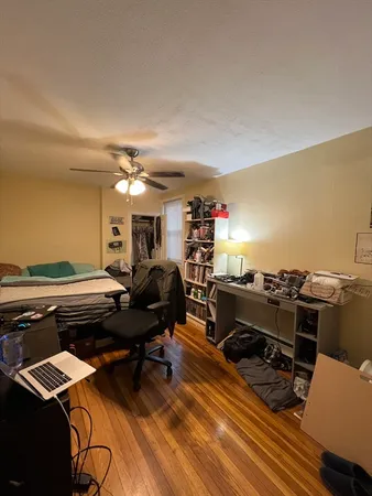 a livingroom with furniture and a stove