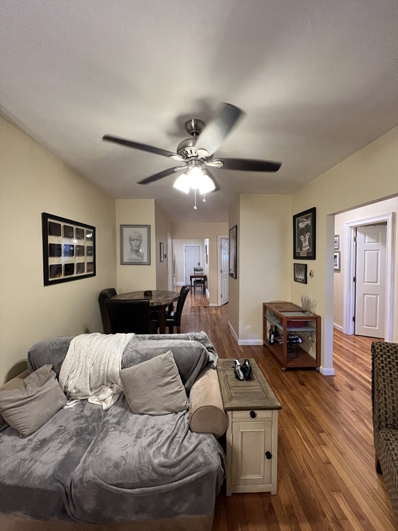 41 Cross Street Somerville, MA 02145 - Photo 5 of 42 a bedroom with furniture and a wooden floor