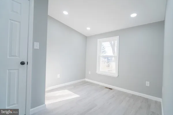 a view of empty room with windows